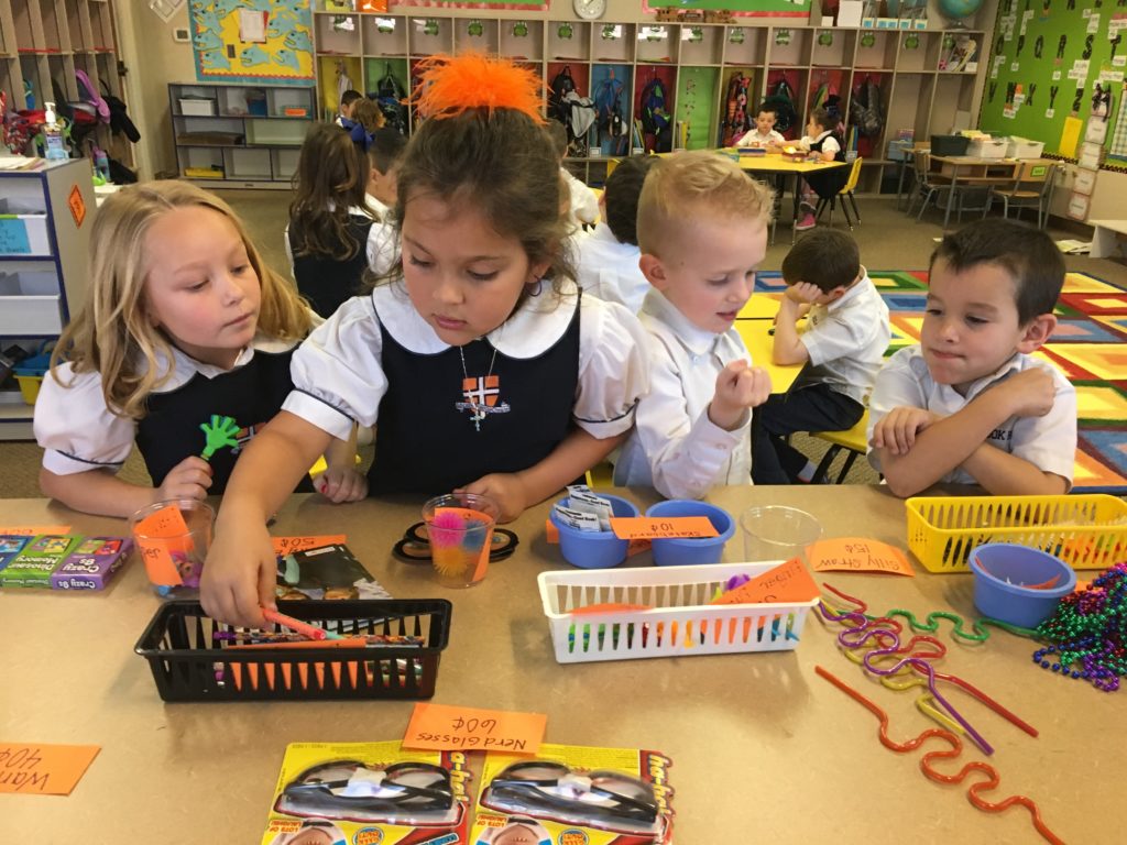 Kindergarten counts money in class store - The Brook Hill School